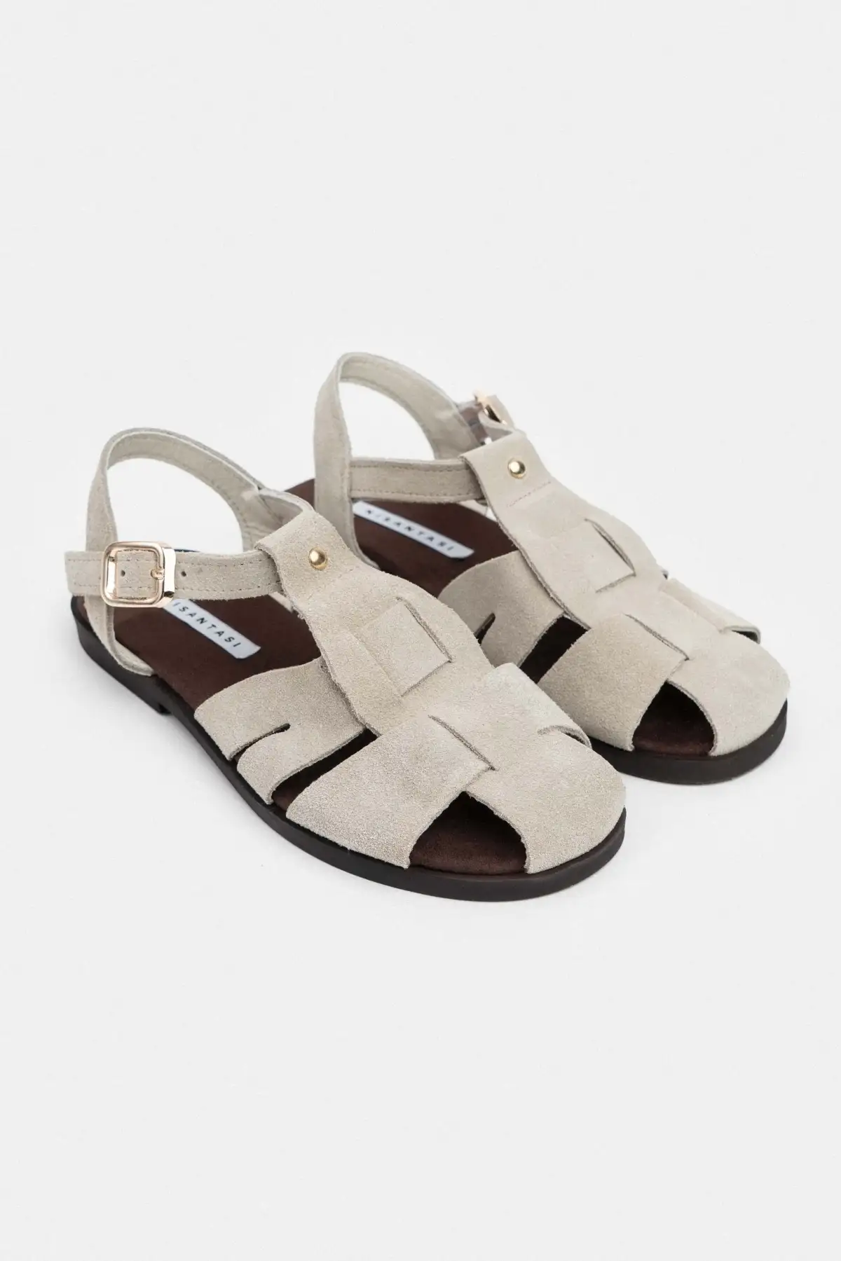 کفش صندل زنانه   ساده با کف تخت، چرم سوئد واقعی و جزئیات قفل دار به رنگ بژ برند NİŞANTAŞI SHOES - 8237 کفش صندل زنانه ساده با کف تخت، چرم سوئد واقعی و جزئیات قفل دار به رنگ بژ برند NİŞANTAŞI SHOES - 8237